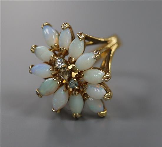 An 18k yellow metal, white opal and white sapphire? set dress ring, size L, gross 3.9 grams.